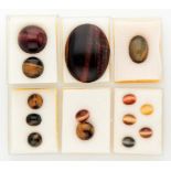 Lot of 14 cabochon cut natural tiger eye and falcon eye.