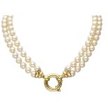 Two-row pearl necklace with a large 18K. yellow gold closure.