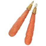 Set of two red coral pendants, both in a 14K. yellow gold setting.