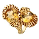 14K. Yellow gold ring set with two pear-shaped faceted citrines.