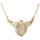 14K. Yellow gold cocktail necklace set with rutile quartz and tanzanite.