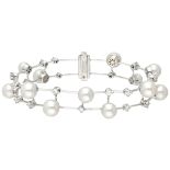 Exclusive Stefan Hafner 18K. white gold bracelet set with approx. 1.51 ct. diamond and pearls.