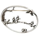 Sterling silver brooch with birds on a branch.