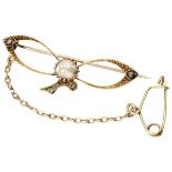 Antique 14K. yellow gold bow-shaped brooch set with diamond.