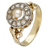 18K. Yellow gold antique entourage ring set with diamonds and a pearl.