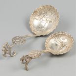 2-piece lot of cream spoons silver.