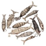 Lot of 10 silver flexible fish pendants, including one perfume pendant.