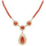 Vintage red coral necklace with a 14K. yellow gold pendant and closure.