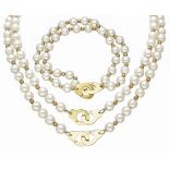 Lot of 2 necklaces and a two-row bracelet with freshwater pearls and 18K. yellow gold closure and de