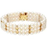 Three-row vintage freshwater pearl bracelet with 18K. yellow gold details.