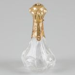 Perfume bottle gold.