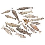 Lot of 18 silver flexible fish pendants.