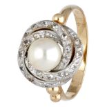 14K. Bicolor gold ring set with a white pearl and cubic zirconia.