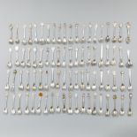 80-piece collection of silver-plated teaspoons.