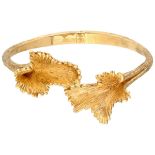 18K. Yellow gold floral design bangle bracelet.