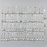 77-piece collection of silver-plated teaspoons.