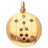 Antique 18K. yellow gold pendant set with seed pearls and glass garnets.