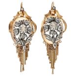 Antique 14K. yellow gold earrings decorated with a silver flower with diamond and a tassel.