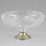 Crystal fruit bowl on a silver foot.