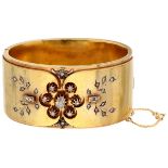 Large antique 14K. yellow gold floral decorated bangle bracelet set with rose cut diamond.