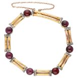 Vintage 14K. yellow gold bracelet set with diamond and garnet.