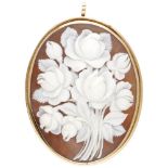 14K. Yellow gold brooch / pendant set with a cameo with botanical representation of flowers.