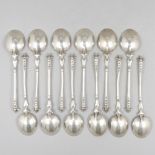 12-piece set of silver tea spoons.