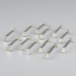 12-piece set of silver-plated knife rests.