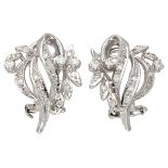 14K. White gold floral shaped ear clips set with approx. 0.46 ct. diamond.