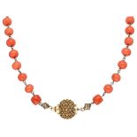 Antique red coral regional costume necklace with a 14K. yellow gold openwork closure.