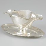 Sauce boat with bottom dish silver.