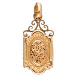 14K. Yellow gold medallion pendant with ornate details.