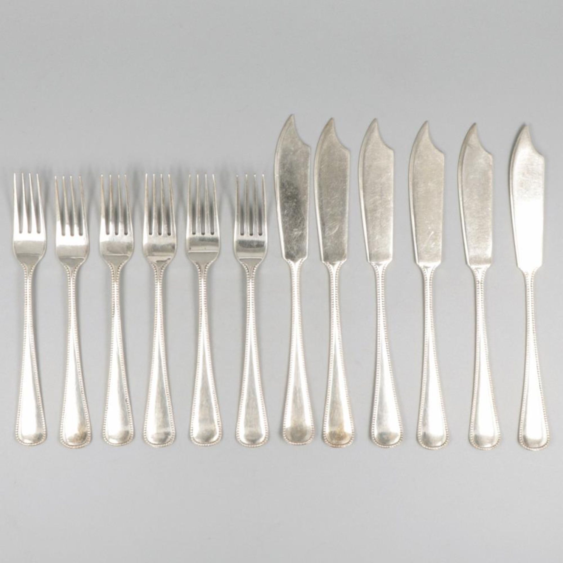 12-piece set of silver fish cutlery.