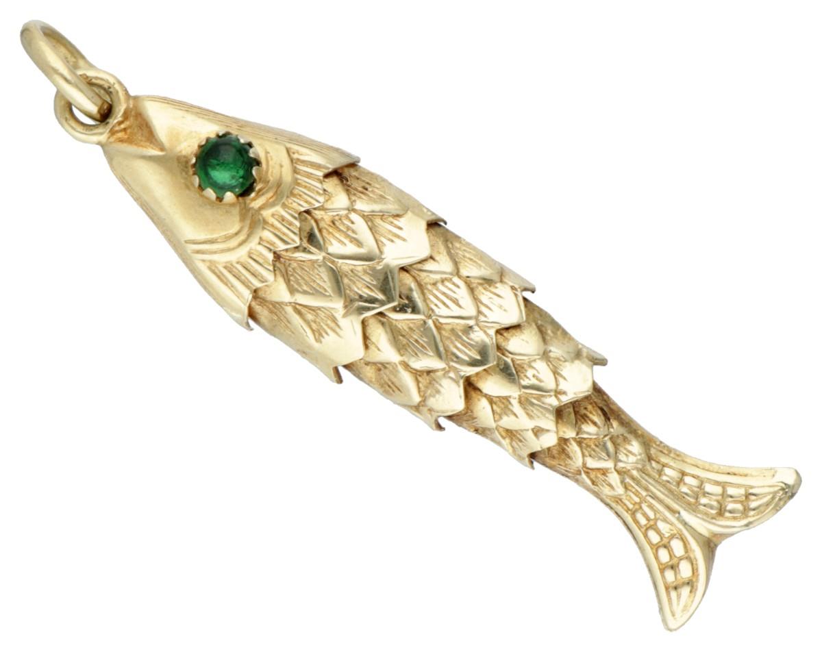Vintage 14K. flexible fish pendant set with green coloured stones in the eyes.