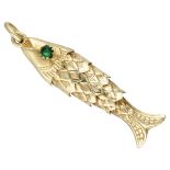 Vintage 14K. flexible fish pendant set with green coloured stones in the eyes.