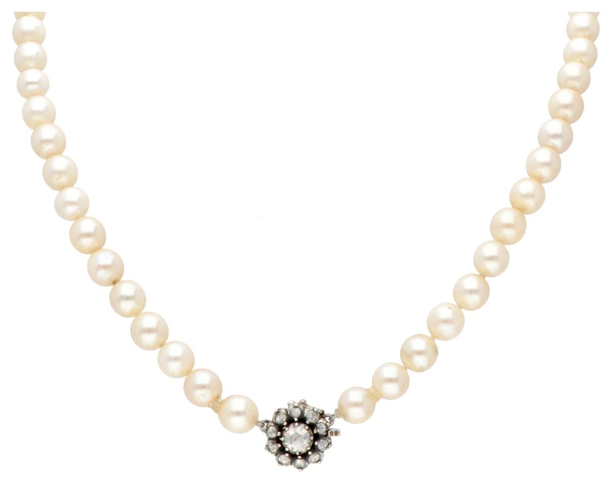 Vintage single strand pearl necklace with a 14K. yellow gold closure set with rose cut diamond.