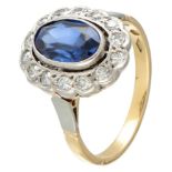 18K. Bicolor gold entourage ring set with approx. 1.46 ct. sapphire and approx. 0.28 ct. diamond.