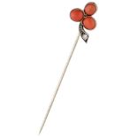 BLA 10K. white gold three-leaf clover lapel pin set with approx. 0.39 ct. red coral and a diamond.