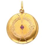 Antique 18K. yellow gold engraved medallion pendant set with natural ruby.