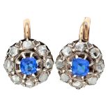 Antique 14K. bicolor gold earrings set with rose cut diamonds and blue colored stones.