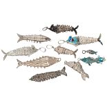 Lot of ten silver vintage flexible fish pendants, some of which are enamelled.