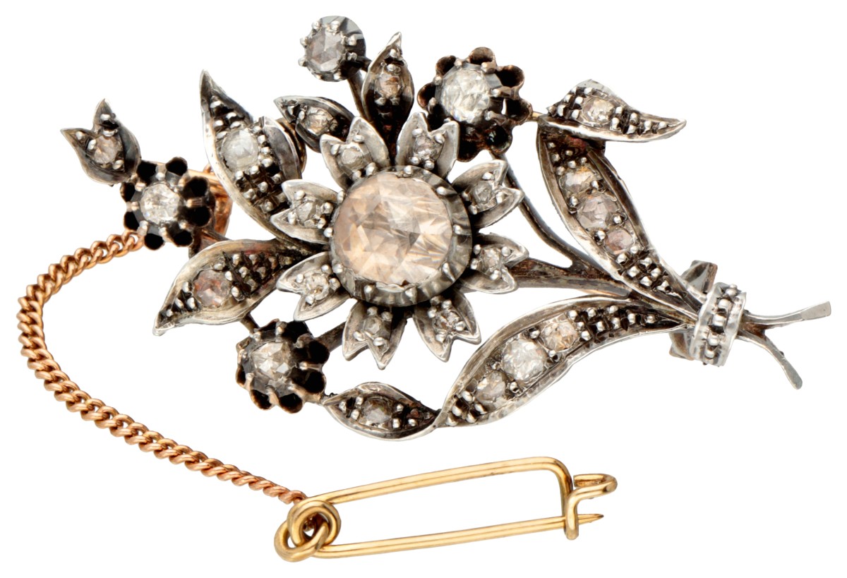 Antique 14K. yellow gold / silver floral brooch set with rose cut diamond.