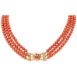 Three-row vintage red coral necklace with 14K. yellow gold closure.