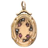 Antique 9K. yellow gold medallion pendant set with garnets and seed pearls.