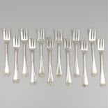 12-piece set of silver pastry forks.