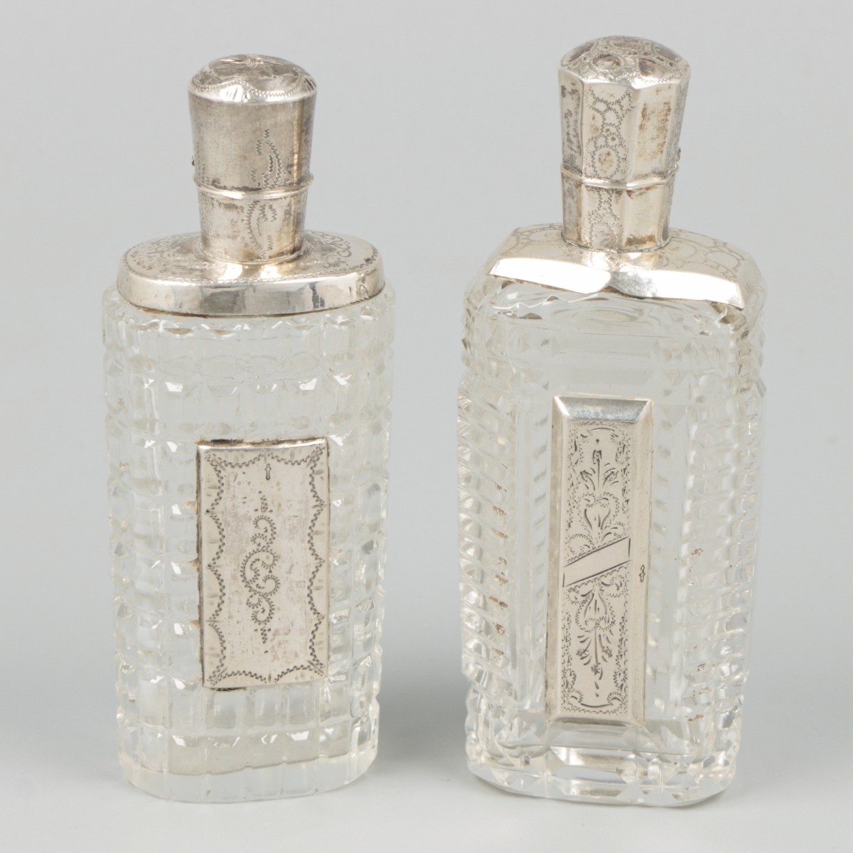 2-piece lot of perfume bottles silver.