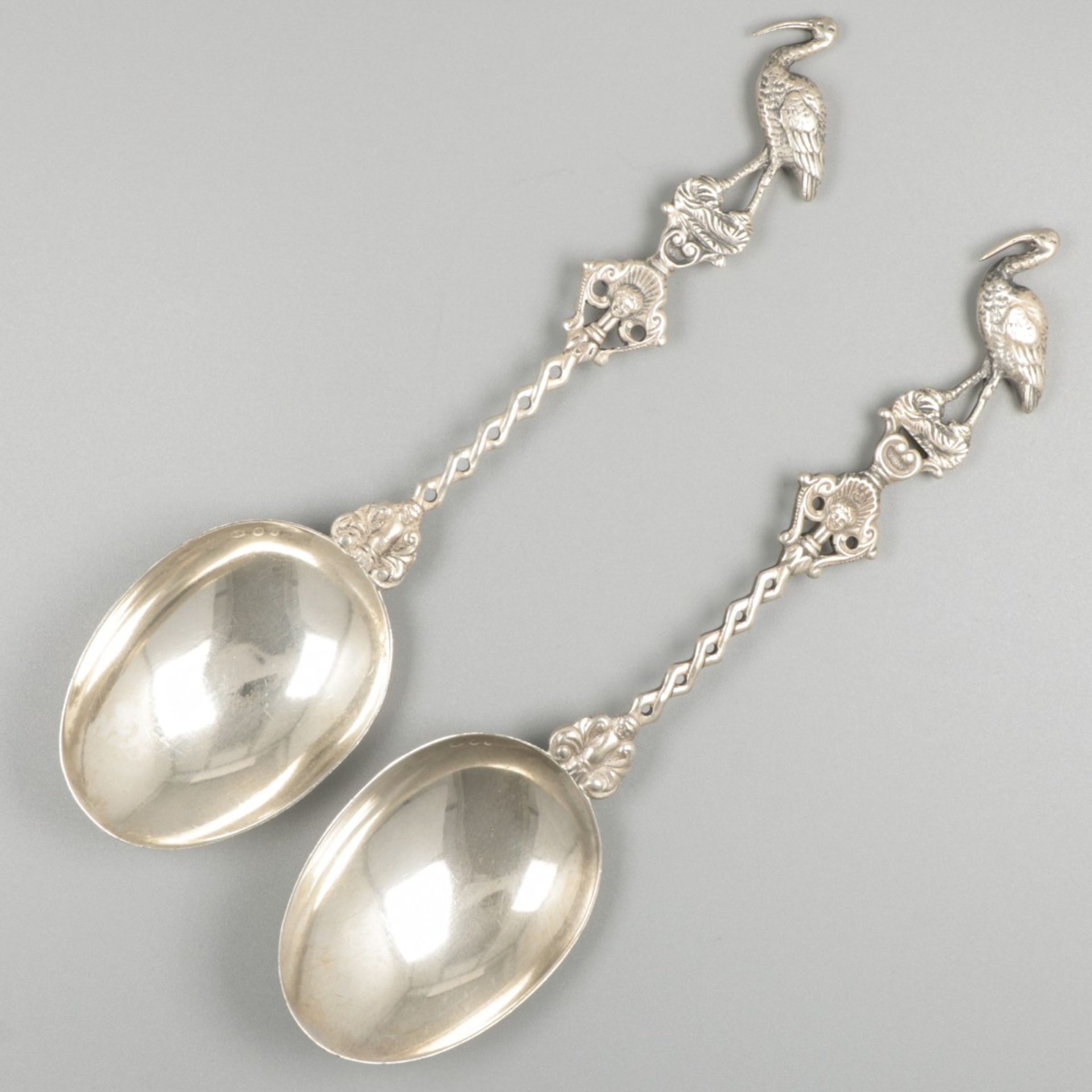 2-piece set of silver occasion spoons.