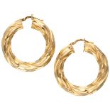 18K. Yellow gold creole earrings with twisted design.