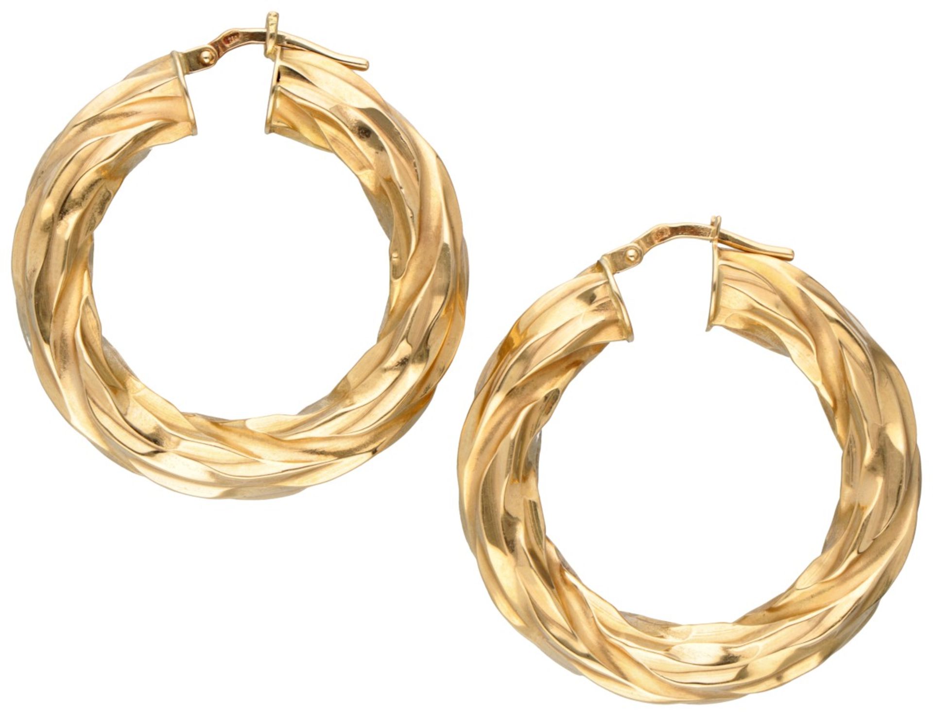 18K. Yellow gold creole earrings with twisted design.