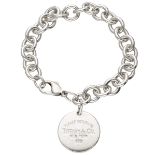 Sterling silver Please Return to Tiffany & Co. bracelet with circular tag.